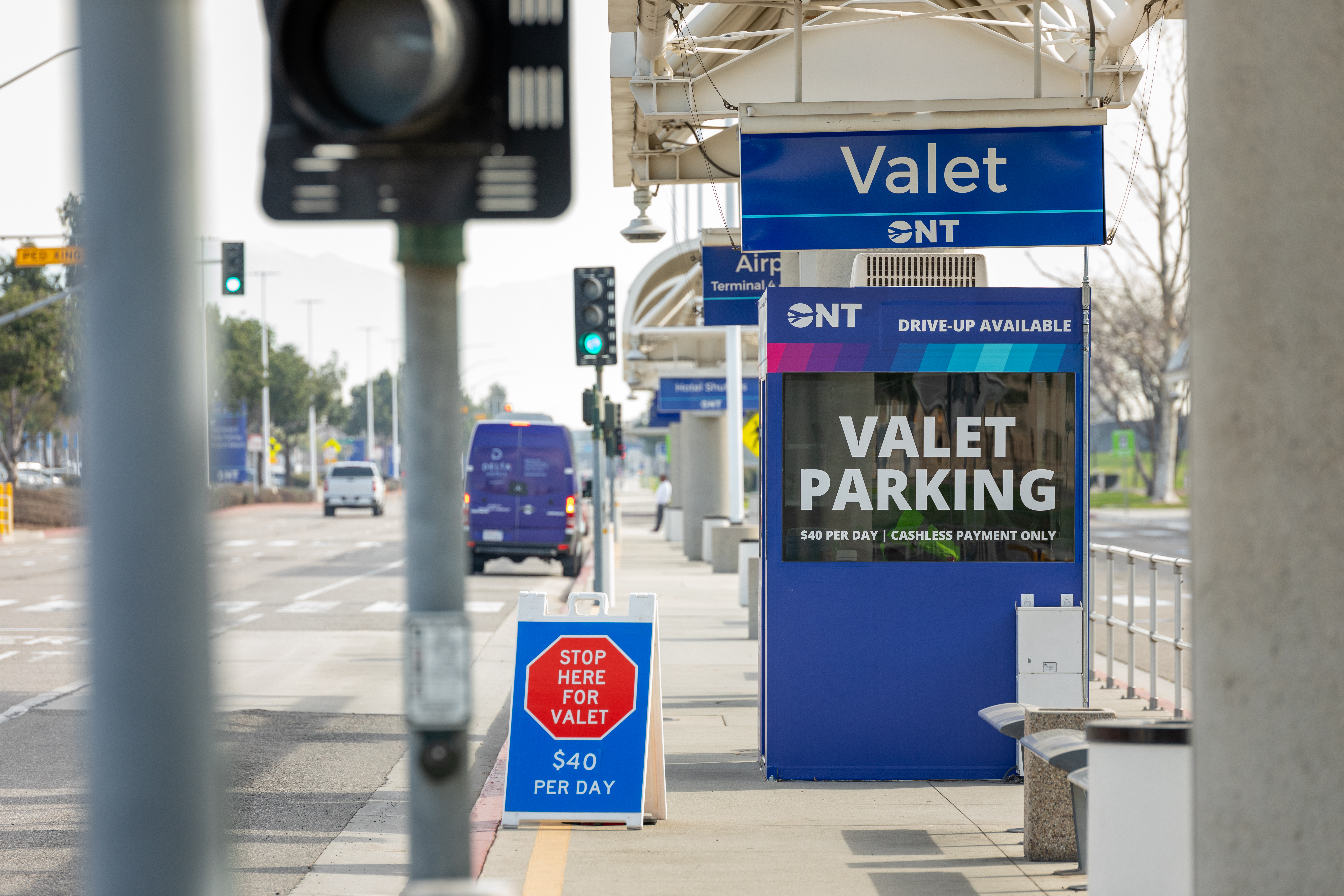The valet parking booth at ONT is shown with a sign that says it costs $40 per day.