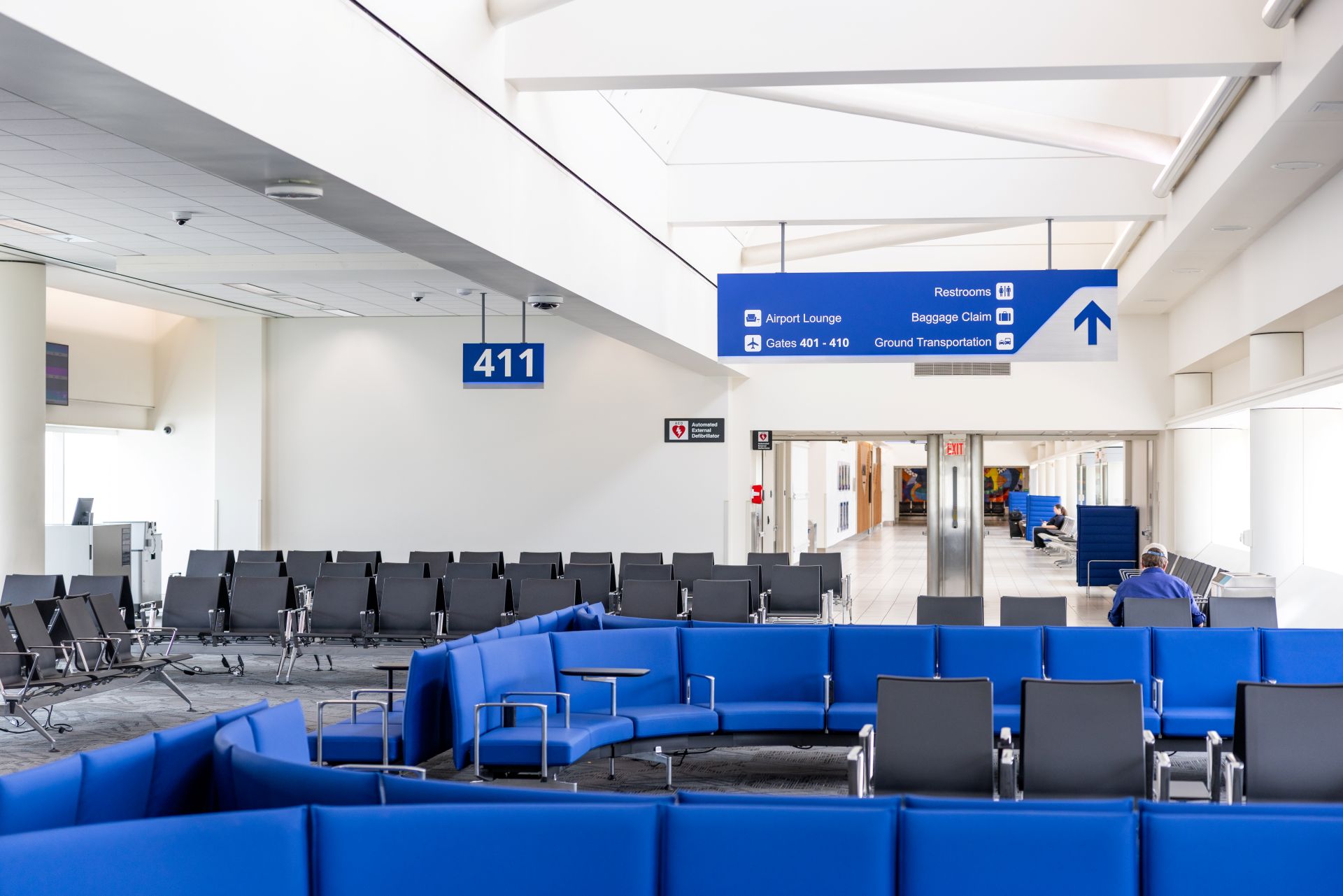 Rows of bright blue seats are shown in Terminal 4.