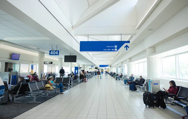 Passengers walking through terminal 
