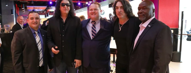 CEO Atif Elkadi is shown with Gene Simmons and other officials inside the terminal.