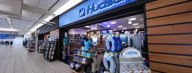The exterior of a Hudson store inside the terminal is shown with blue signage.