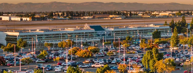 Busy parking lot full of cars at Terminal 2 at Ontario International Airport 