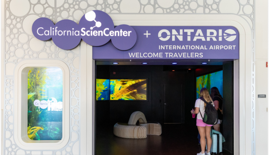 Ontario Tourism Information Center storefront with visitors standing at the entrance.
